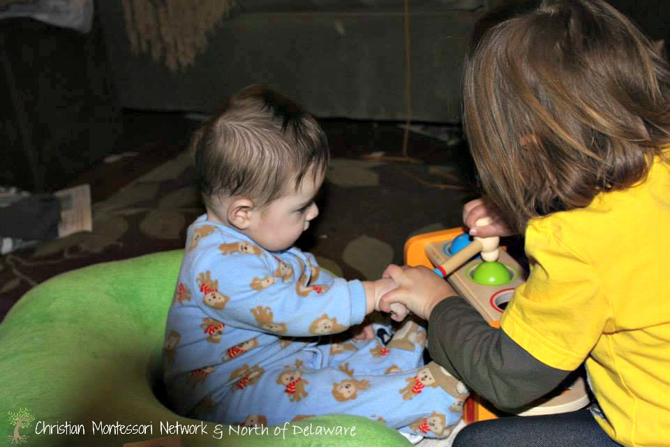 Siblings naturally want to help each other. Guest post from North of Delaware on ChristianMontessoriNetwork.com